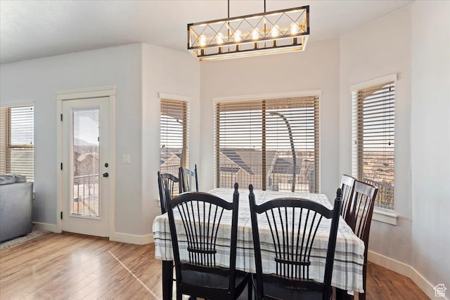 1321 Highland Blvd N, Brigham City, UT 84302 - dining space with wood finished floors, baseboards, and healthy amount of natural light