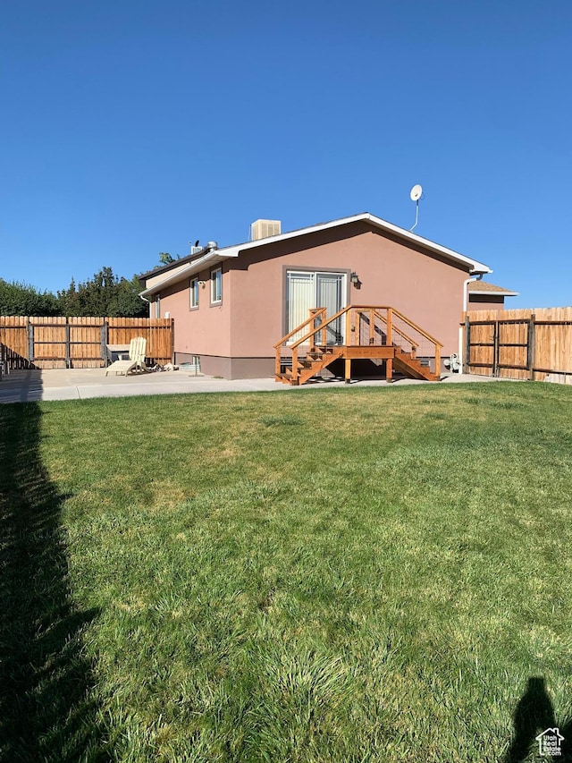 685 W 2550 S, Price, UT 84501 - rear view of house with a yard, a patio, and central air condition unit