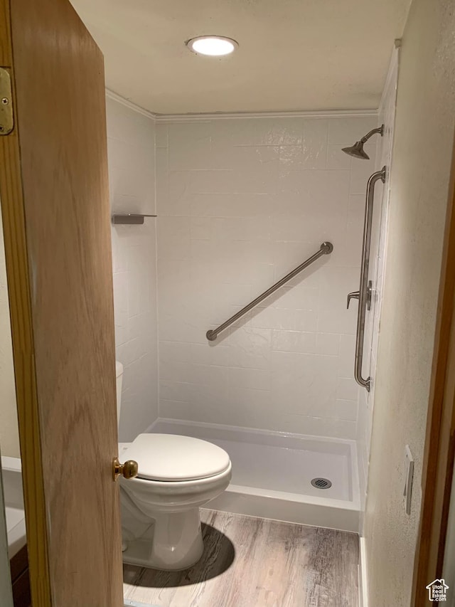 685 W 2550 S, Price, UT 84501 - bathroom featuring hardwood / wood-style flooring, toilet, and a tile shower