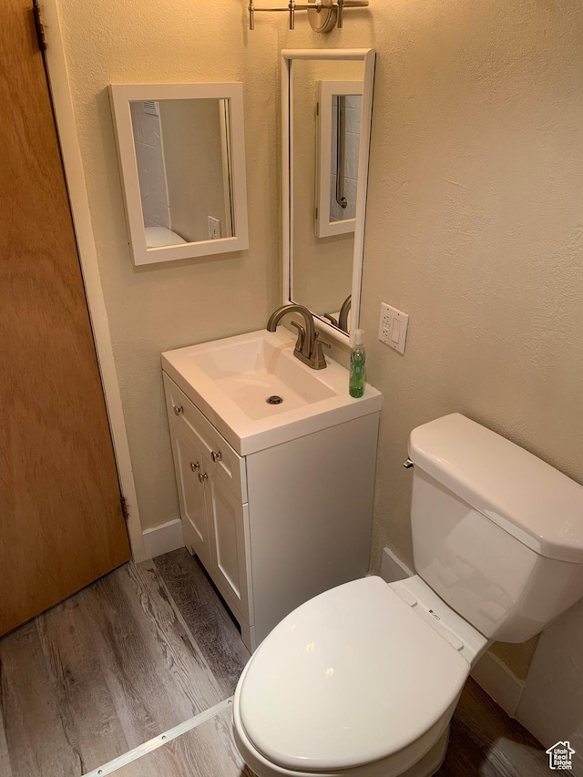 685 W 2550 S, Price, UT 84501 - bathroom with vanity, wood-type flooring, and toilet