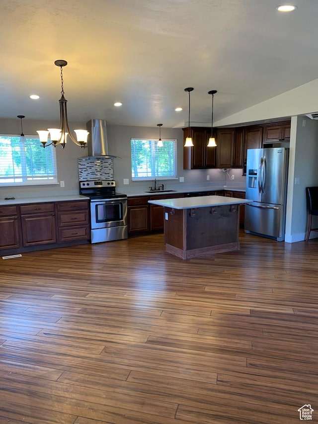 685 W 2550 S, Price, UT 84501 - kitchen featuring stainless steel appliances, extractor fan, hanging light fixtures, and dark hardwood / wood-style floors