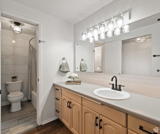 1666 E Hillsboro Dr N, Layton, UT 84040 - full bath with wood finished floors, vanity, toilet, shower / tub combo with curtain, and baseboards