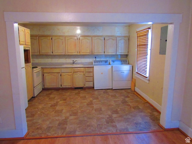kitchen featuring light brown cabinetry, sink, white appliances, electric panel, and independent washer and dryer