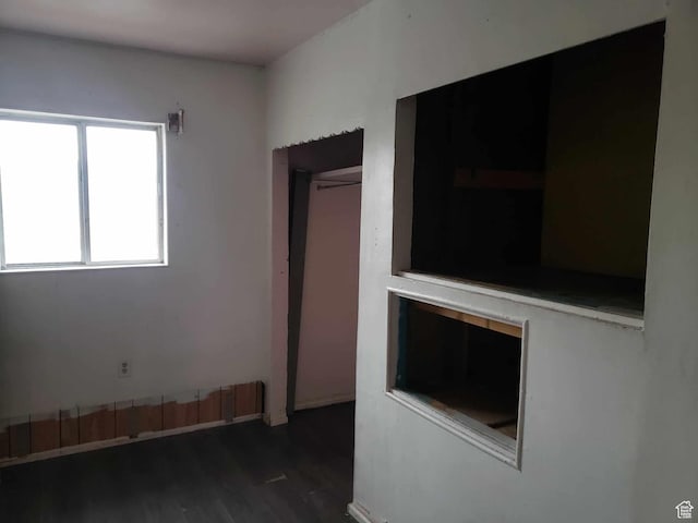 spare room featuring dark hardwood / wood-style floors