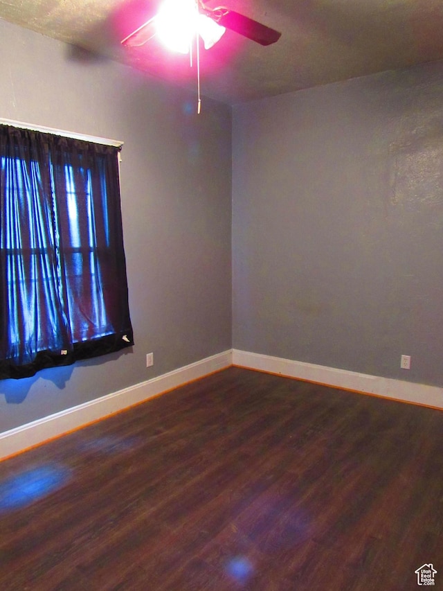 unfurnished room featuring hardwood / wood-style flooring and ceiling fan