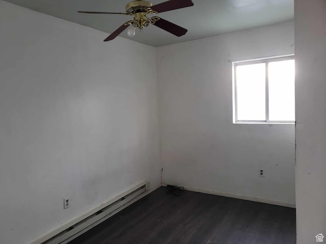 unfurnished room with a baseboard heating unit, dark hardwood / wood-style floors, and ceiling fan
