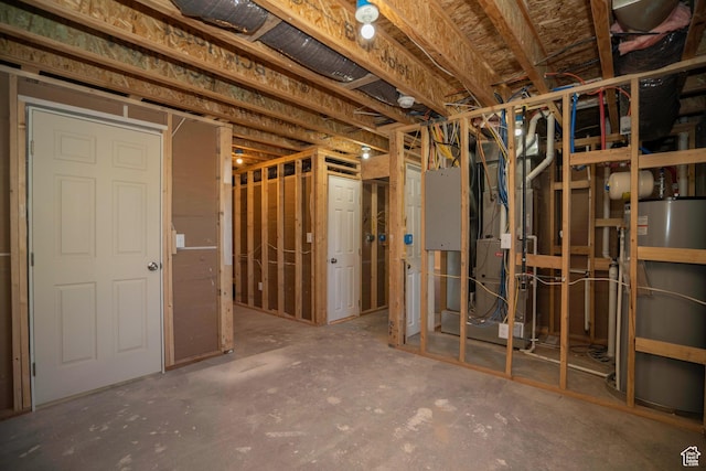 basement featuring water heater and heating unit