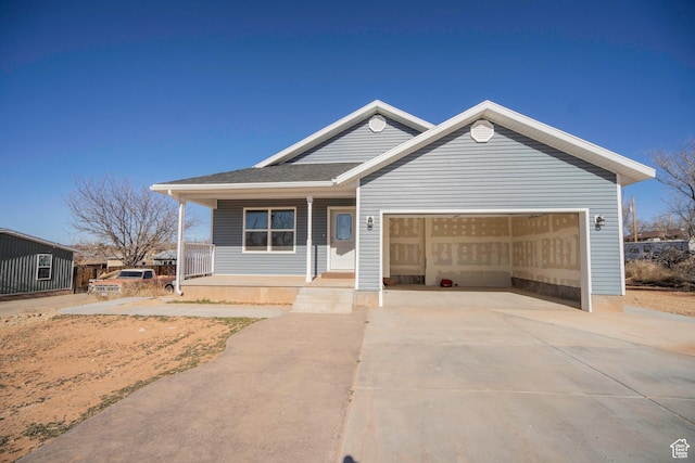 view of front of property with a garage and covered porch