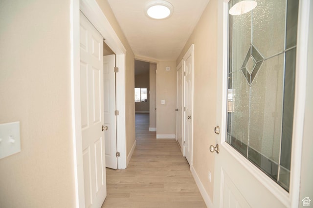 corridor featuring light wood-type flooring