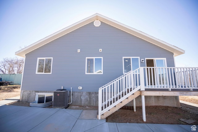 back of house with a patio area and central air condition unit