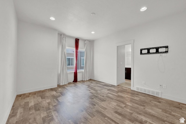 1726 W Thira Ln S, South Jordan, UT 84095 - spare room featuring wood finished floors, recessed lighting, and baseboards