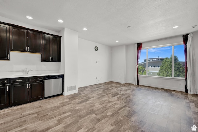 1726 W Thira Ln S, South Jordan, UT 84095 - kitchen with stainless steel dishwasher, a sink, light wood-style floors, baseboards, and recessed lighting