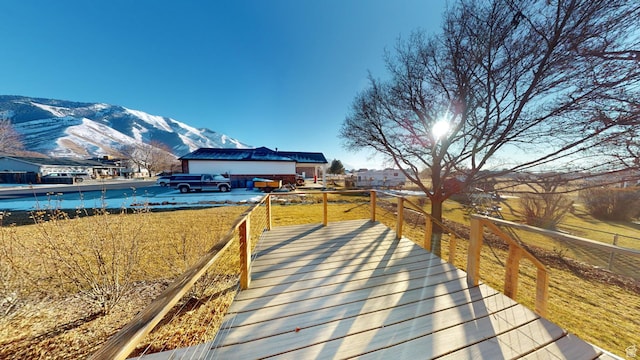 wooden terrace with a mountain view