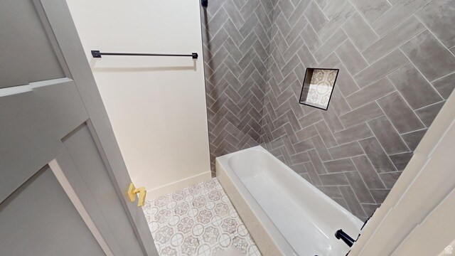 bathroom with tile patterned flooring, shower / tub combination, and tile walls