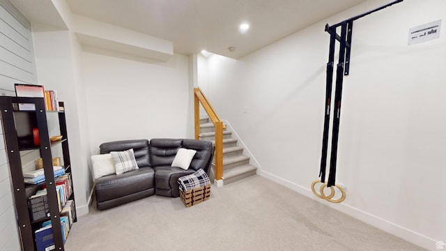 living area with light colored carpet