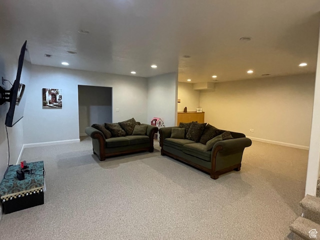 living room featuring baseboards, carpet flooring, and recessed lighting