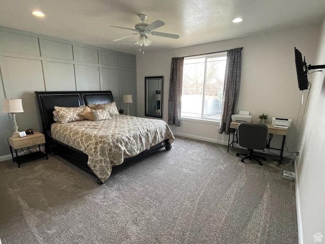 carpeted bedroom featuring ceiling fan, recessed lighting, baseboards, and a decorative wall