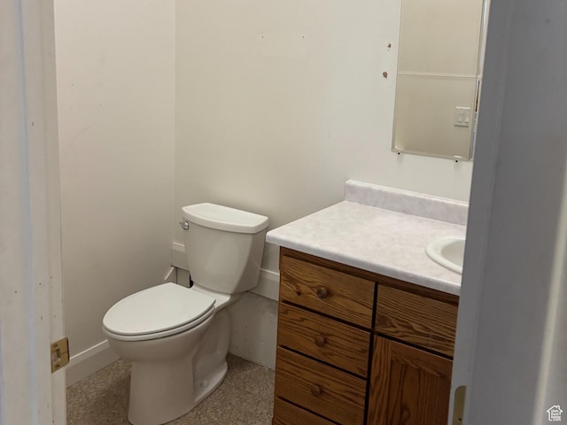 half bath with toilet and vanity
