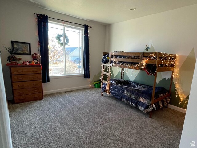 carpeted bedroom with baseboards