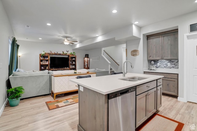 3529 W 4150 S, West Haven, UT 84401 - kitchen featuring tasteful backsplash, sink, stainless steel dishwasher, a center island with sink, and light hardwood / wood-style flooring