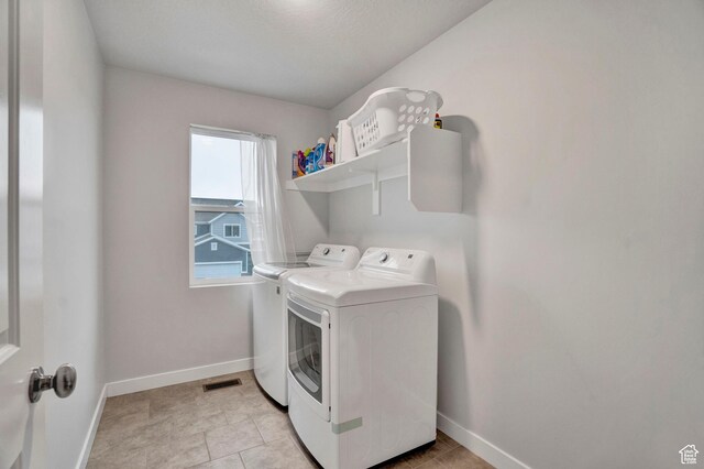 3529 W 4150 S, West Haven, UT 84401 - laundry area featuring independent washer and dryer and light tile patterned floors