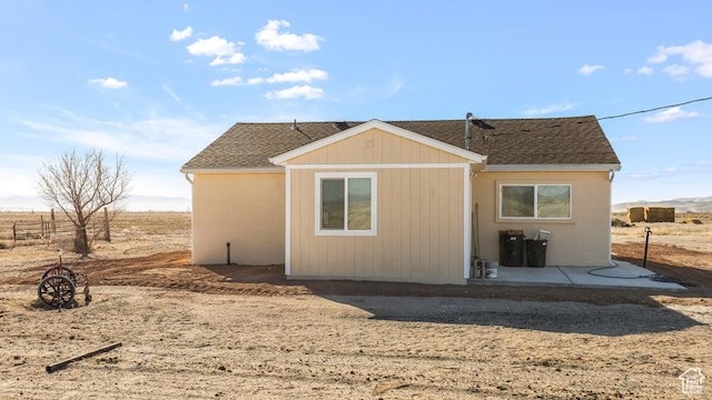 1980 W 3600 N, Beryl, UT 84714 - back of property with a patio and roof with shingles