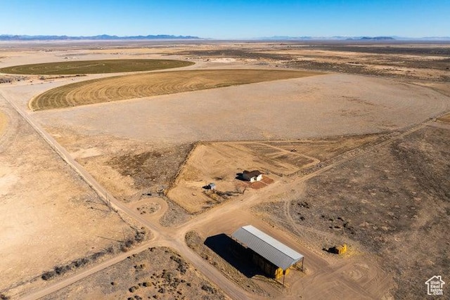 1980 W 3600 N, Beryl, UT 84714 - aerial overview of property's location featuring a desert landscape, a mountain backdrop, and rural landscape