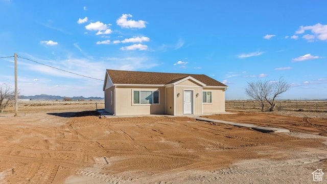 view of front of home featuring a rural view