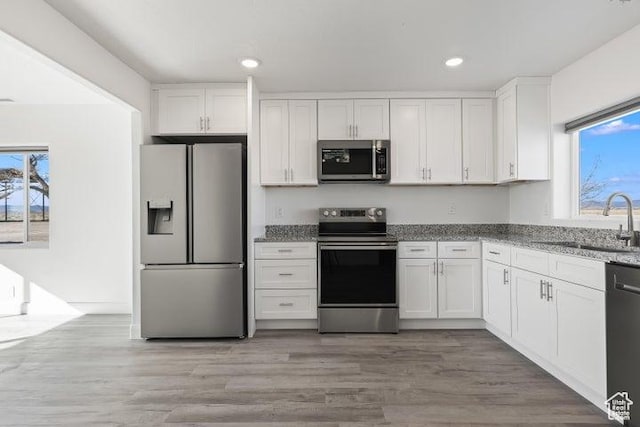 1980 W 3600 N, Beryl, UT 84714 - kitchen featuring stainless steel appliances, a sink, healthy amount of natural light, white cabinetry, and recessed lighting