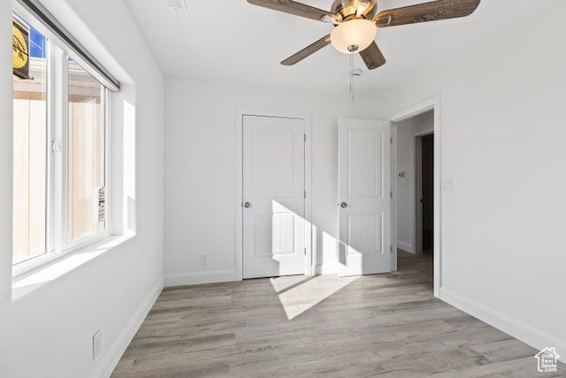 1980 W 3600 N, Beryl, UT 84714 - unfurnished bedroom with baseboards, light wood finished floors, and ceiling fan