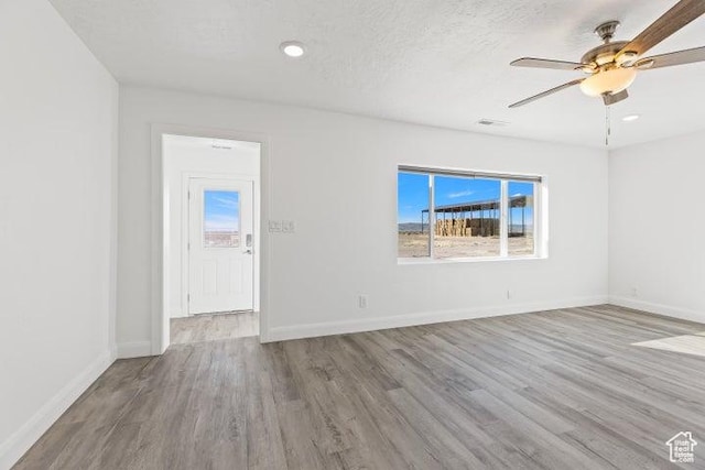 1980 W 3600 N, Beryl, UT 84714 - unfurnished room featuring wood finished floors, ceiling fan, baseboards, and recessed lighting