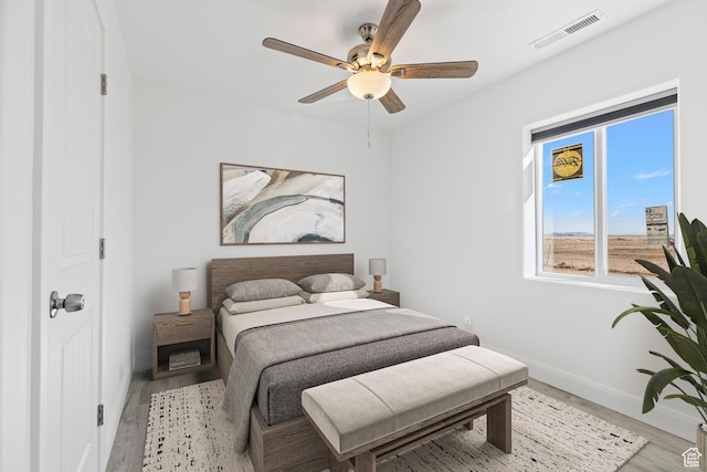 1980 W 3600 N, Beryl, UT 84714 - bedroom with baseboards, light wood-style flooring, and a ceiling fan