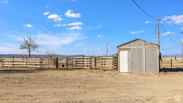 1980 W 3600 N, Beryl, UT 84714 - view of yard featuring fence, a storage shed, a rural view, and an outbuilding
