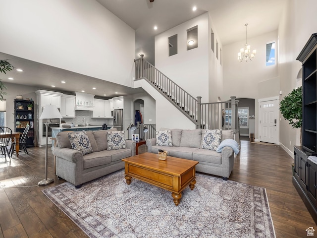 2654 E Water Wheel Ct, Heber City, UT 84032 - living room featuring dark hardwood / wood-style flooring, a notable chandelier, a towering ceiling, and sink