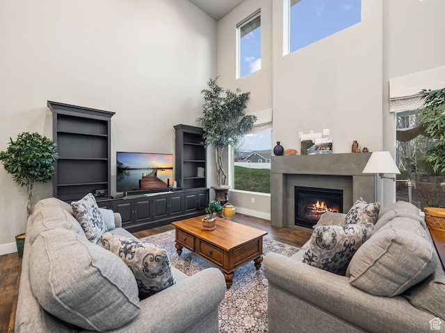 2654 E Water Wheel Ct, Heber City, UT 84032 - living room featuring a high ceiling, a healthy amount of sunlight, and dark hardwood / wood-style flooring