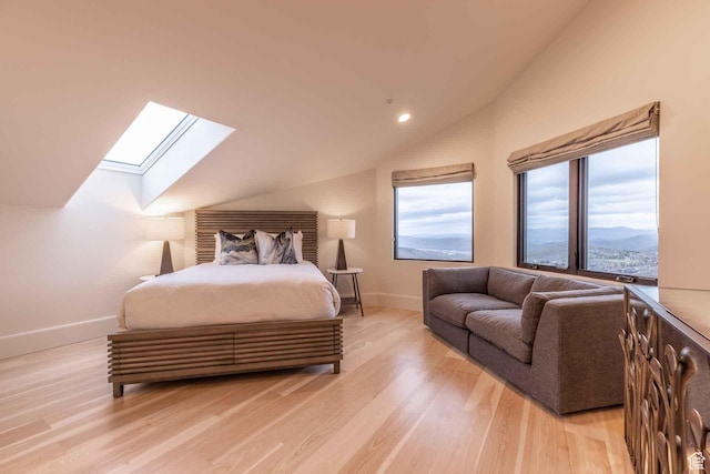 1555 Aerie Cir, Park City, UT 84060 - bedroom with vaulted ceiling with skylight, a mountain view, and light hardwood / wood-style floors