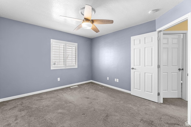 626 S 2310 W, Pleasant Grove, UT 84062 - unfurnished bedroom with ceiling fan, dark carpet, and a textured ceiling