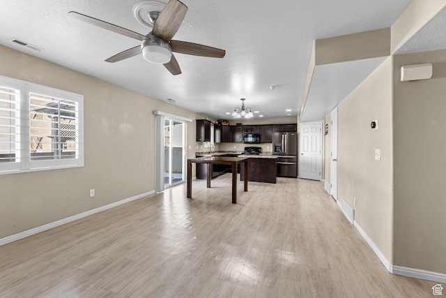 626 S 2310 W, Pleasant Grove, UT 84062 - recreation room featuring ceiling fan with notable chandelier, light hardwood / wood-style flooring, and a textured ceiling