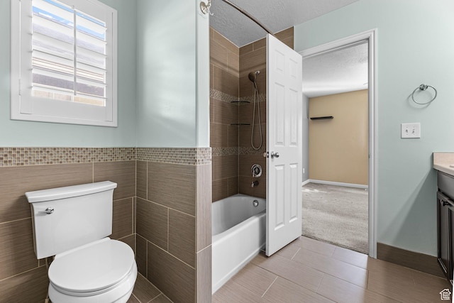 626 S 2310 W, Pleasant Grove, UT 84062 - full bathroom featuring toilet, tiled shower / bath, tile walls, a textured ceiling, and vanity