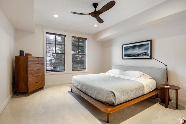 bedroom featuring ceiling fan and light colored carpet