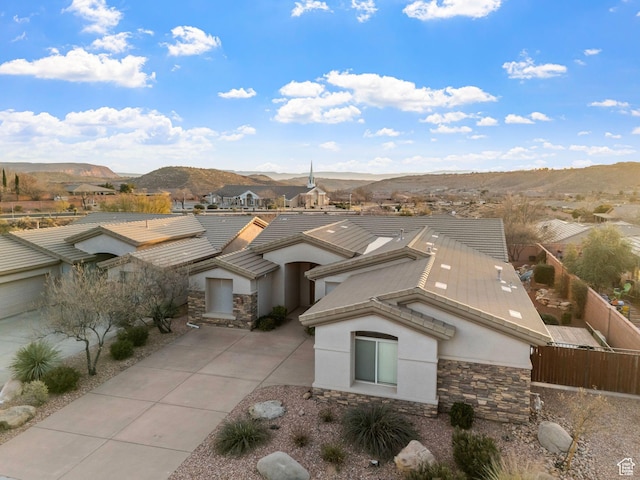 birds eye view of property featuring a mountain view