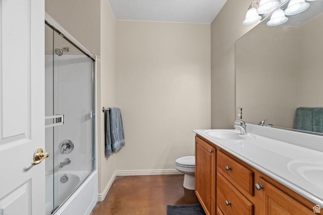 full bathroom featuring toilet, vanity, and shower / bath combination with glass door