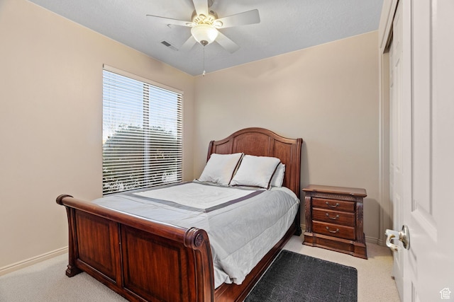 bedroom with light colored carpet and ceiling fan
