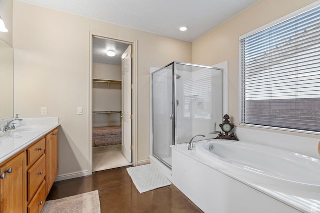bathroom featuring independent shower and bath, vanity, and concrete flooring