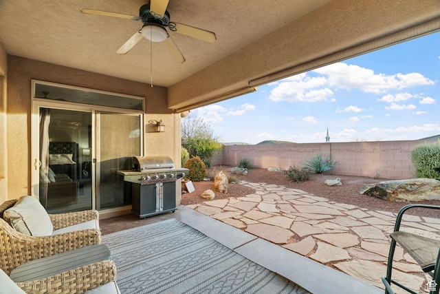 view of patio / terrace with ceiling fan and area for grilling