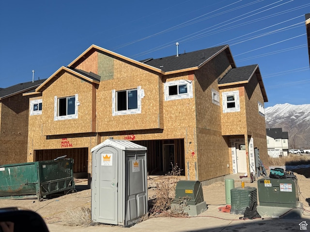 view of front of home featuring a mountain view