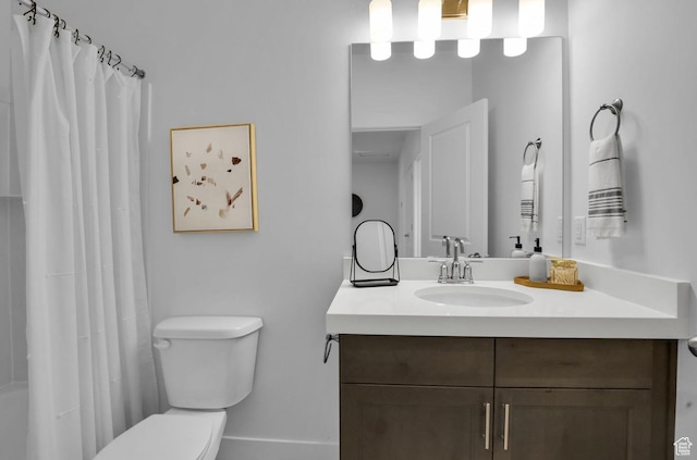 bathroom with vanity, toilet, and a shower with shower curtain