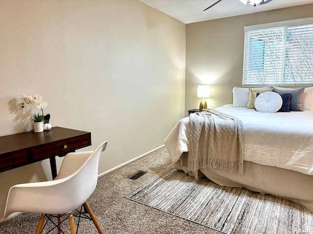 bedroom featuring carpet, visible vents, and baseboards