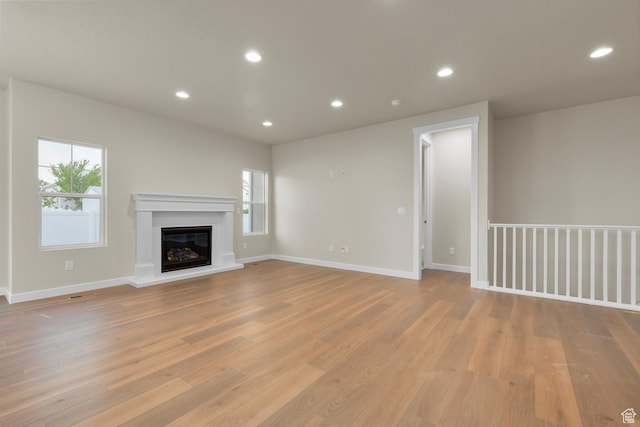 11878 S Golden Pine Ln, Riverton, UT 84065 - unfurnished living room with light hardwood / wood-style floors