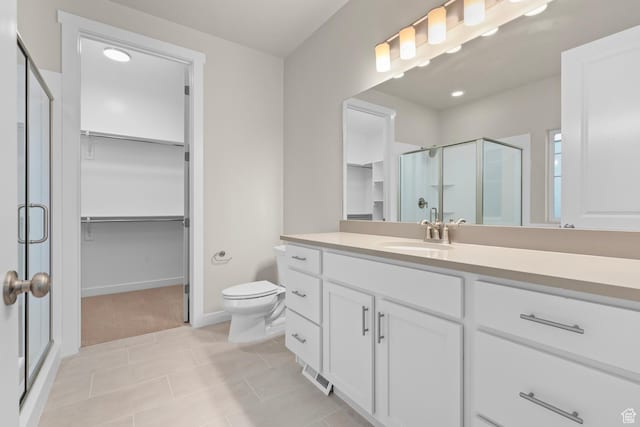 11878 S Golden Pine Ln, Riverton, UT 84065 - bathroom with tile patterned flooring, vanity, toilet, and a shower with shower door